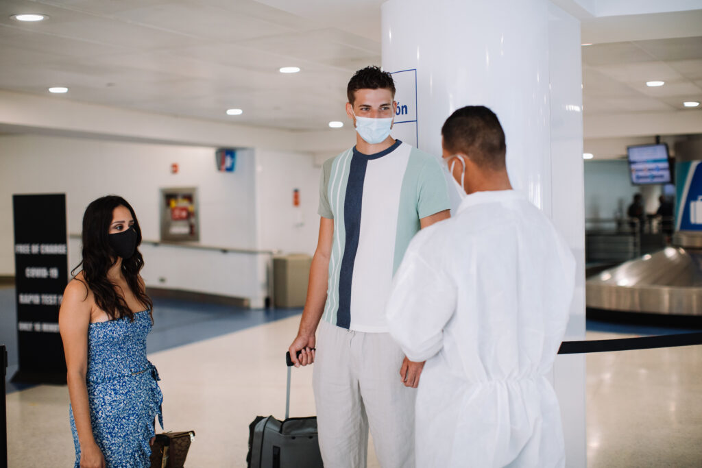 Man and woman arriving at airport and getting tested for COVID 